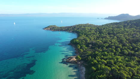 Turquoise-water-aerial-shot-of-Porquerolles-white-sand-beach-France